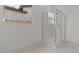 Bright bathroom featuring a walk in shower and window allowing natural light at 550 E Aurora Dr, San Tan Valley, AZ 85140