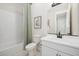 Bright bathroom with a white subway tile shower and modern vanity with a black faucet at 550 E Aurora Dr, San Tan Valley, AZ 85140