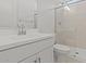 Bathroom featuring tile walls in the shower, with a white vanity and hardware at 550 E Aurora Dr, San Tan Valley, AZ 85140