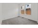 Empty bedroom with neutral carpet and bright natural light at 550 E Aurora Dr, San Tan Valley, AZ 85140