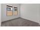 Carpeted bedroom has a window offering natural light and a view at 550 E Aurora Dr, San Tan Valley, AZ 85140