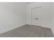 Empty bedroom with neutral carpet and white walls offers a blank canvas for personalization and design at 550 E Aurora Dr, San Tan Valley, AZ 85140