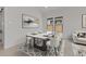 Elegant dining room featuring a modern table setting and stylish decor at 550 E Aurora Dr, San Tan Valley, AZ 85140