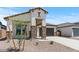 Charming stucco home featuring stone accents and a well-manicured desert landscape at 550 E Aurora Dr, San Tan Valley, AZ 85140