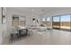 Open-concept living and dining area featuring stylish decor and ample natural light at 550 E Aurora Dr, San Tan Valley, AZ 85140