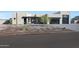 Modern home with desert landscaping, black-framed windows, and a glass garage door at 7175 E Rancho Del Oro Dr, Scottsdale, AZ 85266