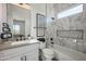 Bright bathroom featuring a marble tiled shower and tub, modern fixtures and artistic decorations at 7195 E Rancho Del Oro Dr, Scottsdale, AZ 85266