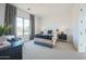 Inviting bedroom with large window and decorative curtains, upholstered chair, and contemporary decor at 7195 E Rancho Del Oro Dr, Scottsdale, AZ 85266