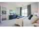 Bright bedroom with dark wood dresser, large picture window, decorative curtains and contemporary decor at 7195 E Rancho Del Oro Dr, Scottsdale, AZ 85266