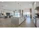 Modern kitchen with a large island, stainless steel appliances and seamless flow to the living area at 7195 E Rancho Del Oro Dr, Scottsdale, AZ 85266