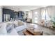 Open living space with a white couch, blue kitchen cabinets, and neutral accents at 7195 E Rancho Del Oro Dr, Scottsdale, AZ 85266