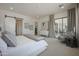 Bright main bedroom with sliding doors to patio and a luxurious design at 7195 E Rancho Del Oro Dr, Scottsdale, AZ 85266