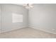 Bedroom with neutral carpet, gray walls, ceiling fan, and window at 726 S Nebraska St # 91, Chandler, AZ 85225