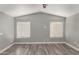 Spacious room with vaulted ceilings, plank flooring, and a neutral paint scheme at 726 S Nebraska St # 91, Chandler, AZ 85225