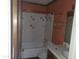 Bathroom area with tile tub and sink at 7617 E Thunderbird Rd, Scottsdale, AZ 85260