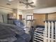 Spacious bedroom with ceiling fan awaiting renovation at 7617 E Thunderbird Rd, Scottsdale, AZ 85260