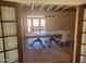 Dining room with tiled floors and chandelier, seen through doors at 7617 E Thunderbird Rd, Scottsdale, AZ 85260