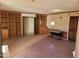 Spacious living room with wood built-ins, closet and ample natural light at 7617 E Thunderbird Rd, Scottsdale, AZ 85260