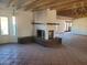 Bright living room features a brick fireplace and exposed beam ceiling at 7617 E Thunderbird Rd, Scottsdale, AZ 85260