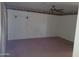 Empty living room featuring neutral walls, fan and carpet flooring at 7617 E Thunderbird Rd, Scottsdale, AZ 85260
