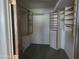 Walk-in closet with built-in shelving and drawers for storage at 7617 E Thunderbird Rd, Scottsdale, AZ 85260