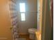 Well-lit bathroom with shower curtain, toilet and vanity at 7750 E Broadway Rd # 212, Mesa, AZ 85208