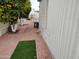 Charming community street view with mature citrus trees and colorful walkway at 7750 E Broadway Rd # 212, Mesa, AZ 85208