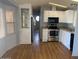 Functional kitchen includes an oven, microwave, and plenty of storage space at 7750 E Broadway Rd # 212, Mesa, AZ 85208