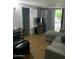 Cozy living room with hardwood floors, neutral walls, comfortable seating and sliding glass doors to the outside at 7750 E Broadway Rd # 212, Mesa, AZ 85208