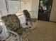 Covered porch features two rocking chairs and a side table at 7750 E Broadway Rd # 212, Mesa, AZ 85208