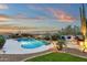 Expansive backyard featuring a private pool and firepit at 11036 E Evans Rd, Scottsdale, AZ 85255