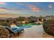 Tranquil backyard pool with lush landscaping and mountain views, offering a serene retreat for relaxation and enjoyment at 11036 E Evans Rd, Scottsdale, AZ 85255