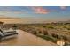 Spacious balcony with lounge seating, offering stunning panoramic views of the surrounding landscape at 11036 E Evans Rd, Scottsdale, AZ 85255
