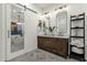 Bathroom with dual sinks, granite countertops, and decorative mirror at 11036 E Evans Rd, Scottsdale, AZ 85255