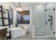 Bright bathroom with a freestanding tub and glass-enclosed shower at 11036 E Evans Rd, Scottsdale, AZ 85255