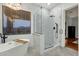 Bright bathroom with a freestanding tub and glass-enclosed shower at 11036 E Evans Rd, Scottsdale, AZ 85255