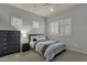 Serene bedroom featuring soft gray walls and carpet, complete with light-blocking window shades at 11036 E Evans Rd, Scottsdale, AZ 85255
