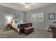 Comfortable bedroom with neutral paint and a window with plantation shutters at 11036 E Evans Rd, Scottsdale, AZ 85255