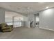 Spacious bonus room with plush carpeting, a ceiling fan, and an abundance of natural light at 11036 E Evans Rd, Scottsdale, AZ 85255
