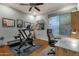 Home gym with exercise equipment, ceiling fan, and natural light at 11036 E Evans Rd, Scottsdale, AZ 85255
