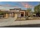 Beautiful two-story home with a three-car garage and desert landscaping at 11036 E Evans Rd, Scottsdale, AZ 85255