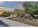 Stunning stucco home with a three-car garage and desert landscaping at 11036 E Evans Rd, Scottsdale, AZ 85255