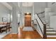 Grand foyer featuring hardwood floors, soaring ceilings, and a staircase at 11036 E Evans Rd, Scottsdale, AZ 85255