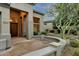 Inviting front entrance with stone walkway and lush desert landscaping at 11036 E Evans Rd, Scottsdale, AZ 85255
