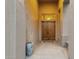 Close up of an elegant front entryway featuring a grand wooden door at 11036 E Evans Rd, Scottsdale, AZ 85255