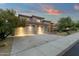 Beautiful home exterior featuring a spacious three-car garage at 11036 E Evans Rd, Scottsdale, AZ 85255