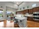 Gourmet kitchen features hardwood floors, recessed lighting, and a dining area with picturesque backyard views at 11036 E Evans Rd, Scottsdale, AZ 85255