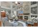 Spacious living room with fireplace, hardwood floors, and an open floor plan perfect for entertaining at 11036 E Evans Rd, Scottsdale, AZ 85255