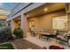 Spacious covered patio with cushioned seating, offering a relaxing outdoor living space for entertaining and leisure at 11036 E Evans Rd, Scottsdale, AZ 85255