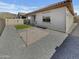 Low-maintenance backyard featuring a patio, gravel, and faux grass at 12164 S 184Th Ave, Goodyear, AZ 85338